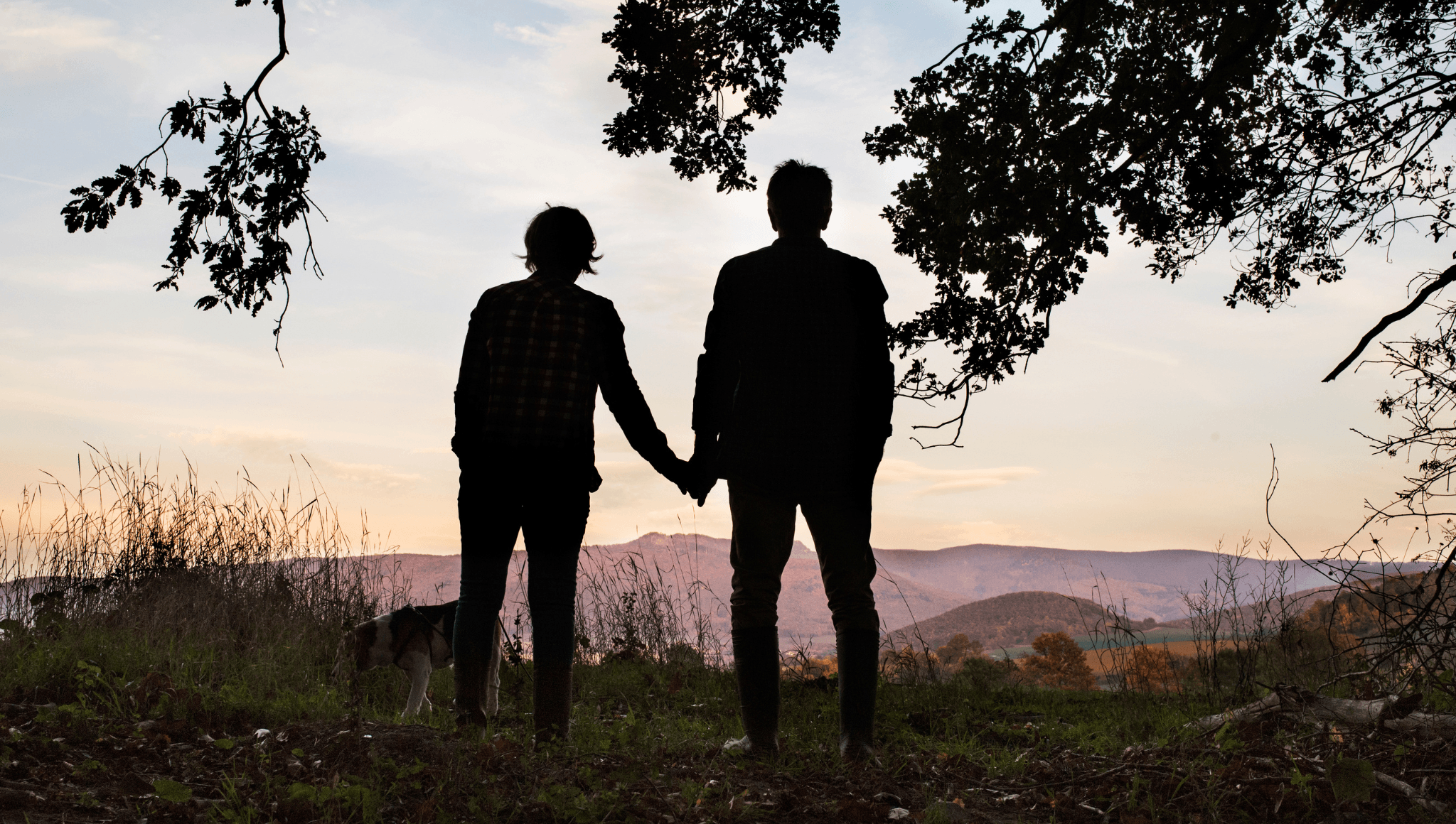 Two people looking at the sunset