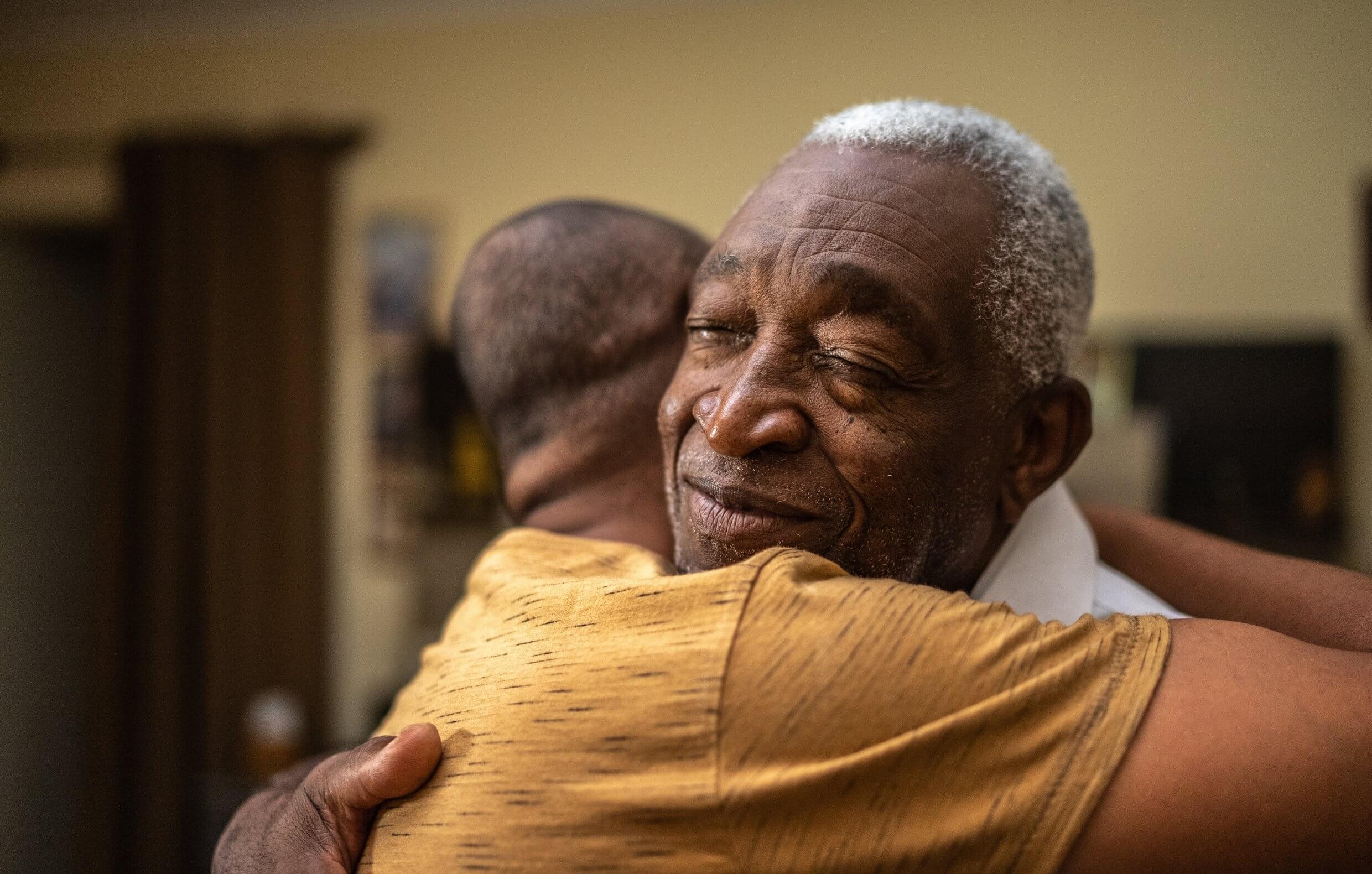 Two men hugging
