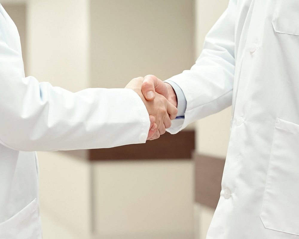 medical professionals shaking hands