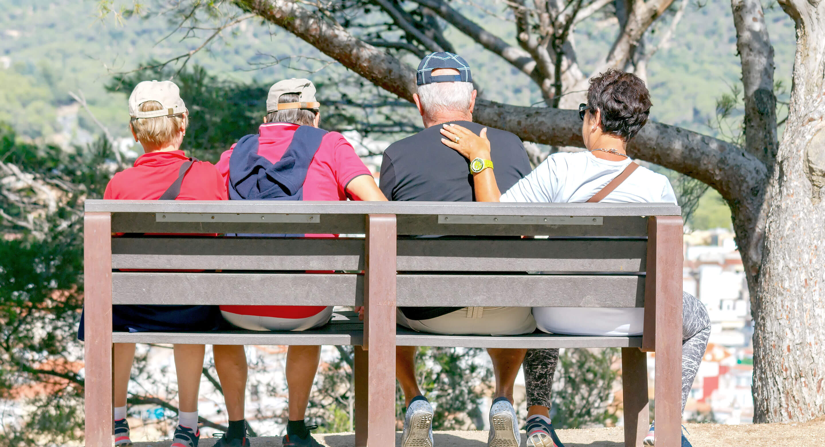 Elderly tourists sitting on a bench