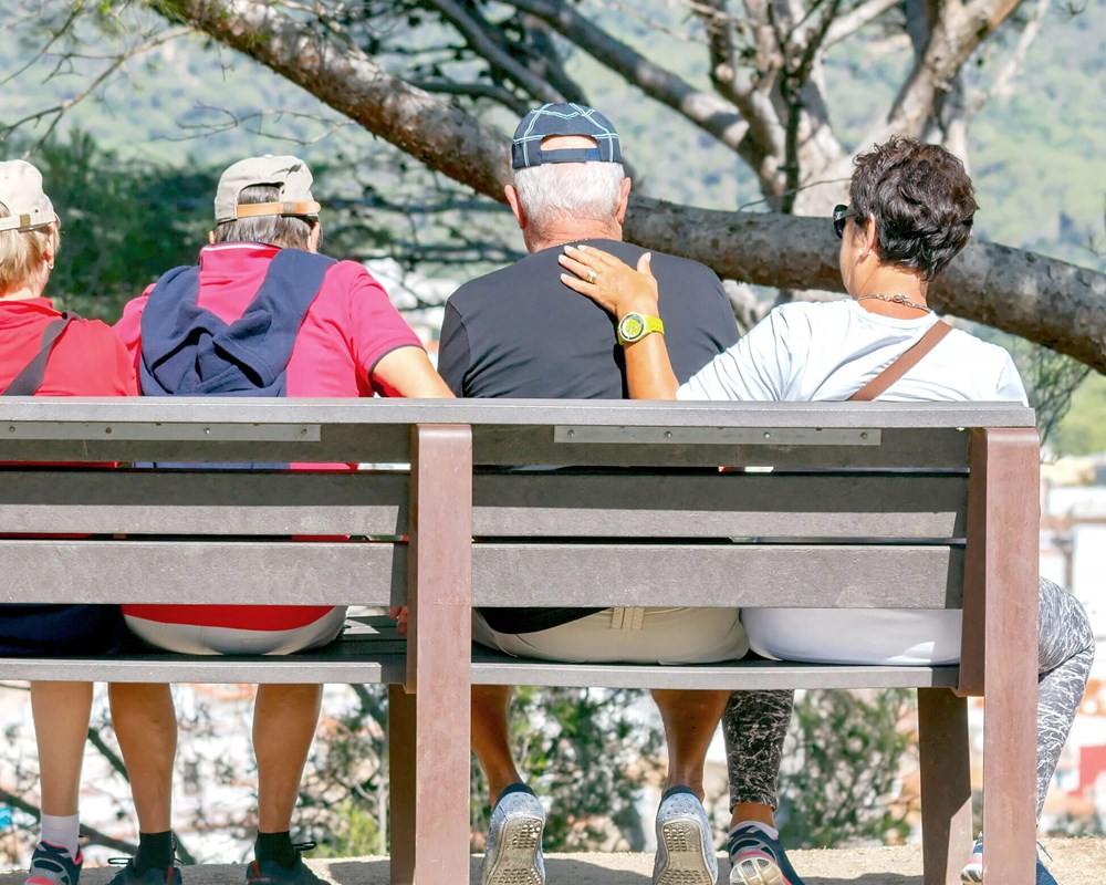 Elderly tourists sitting on a bench