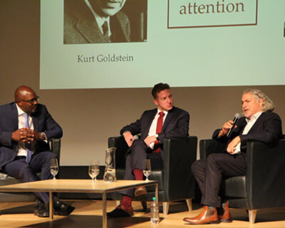 Dr. Kwame McKenzie, CEO of the Wellesley Institute, Elliot Cappell, City of Toronto Chief Resilience Officer, and Dr. Nikolas Rose answer questions from the audience