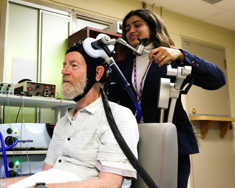 Don Palmer, a research volunteer, and Apoorva Bhandari, Research Analyst in Geriatric Psychiatry at CAMH, demonstrate the innovative, CAMH-developed approach to study brain plasticity in the frontal lobes