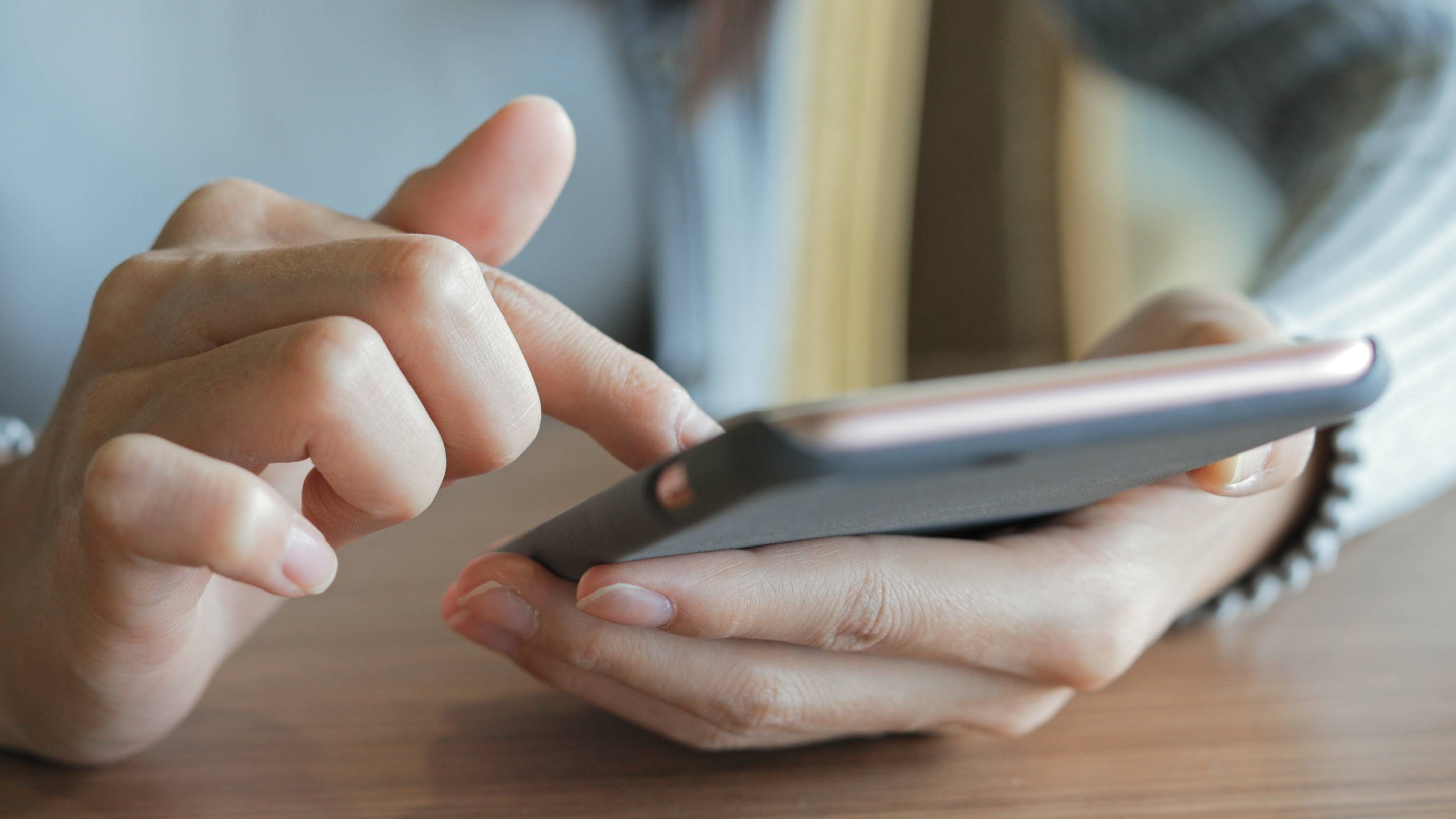 Close-up of person using phone