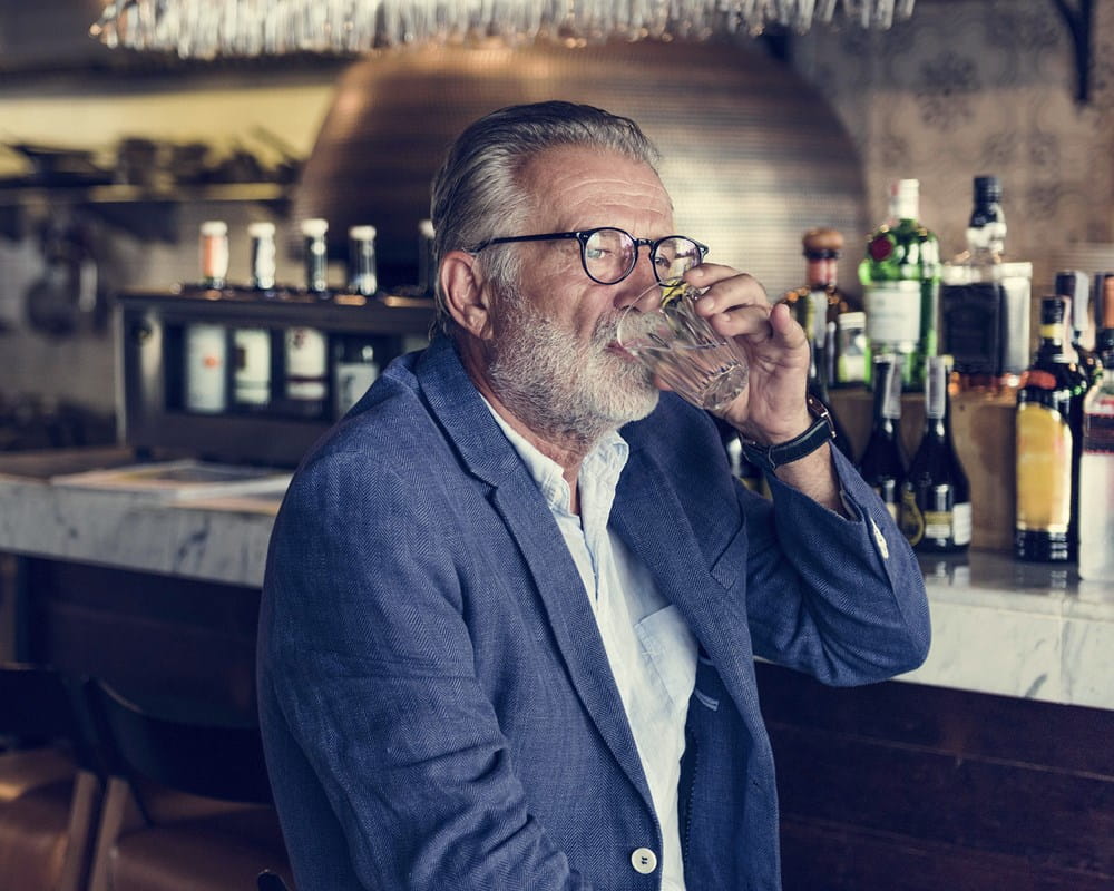 Older man drinking