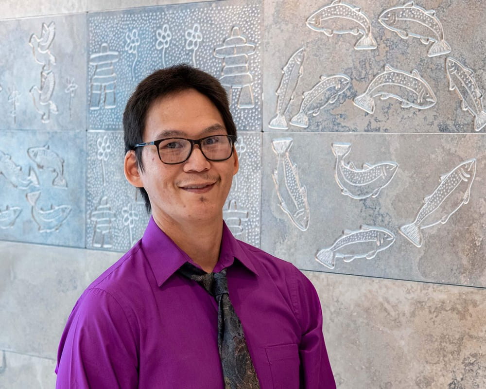 Simon Shimout with mural