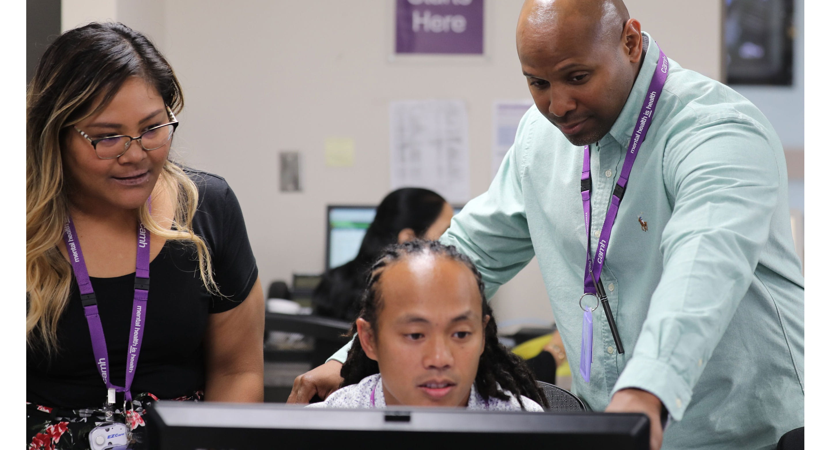 Staff looking at computer at CAMH's Gerald Sheff and Shanitha Kachan Emergency Department
