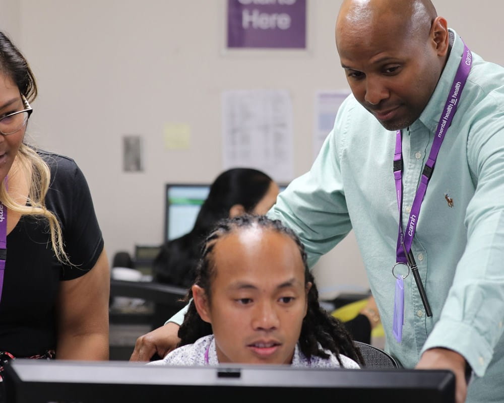 Staff looking at computer at CAMH's Gerald Sheff and Shanitha Kachan Emergency Department