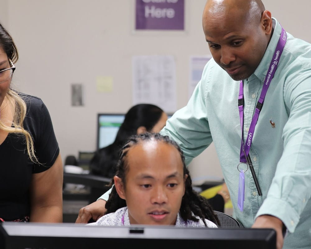 Staff looking at computer at CAMH's Gerald Sheff and Shanitha Kachan Emergency Department