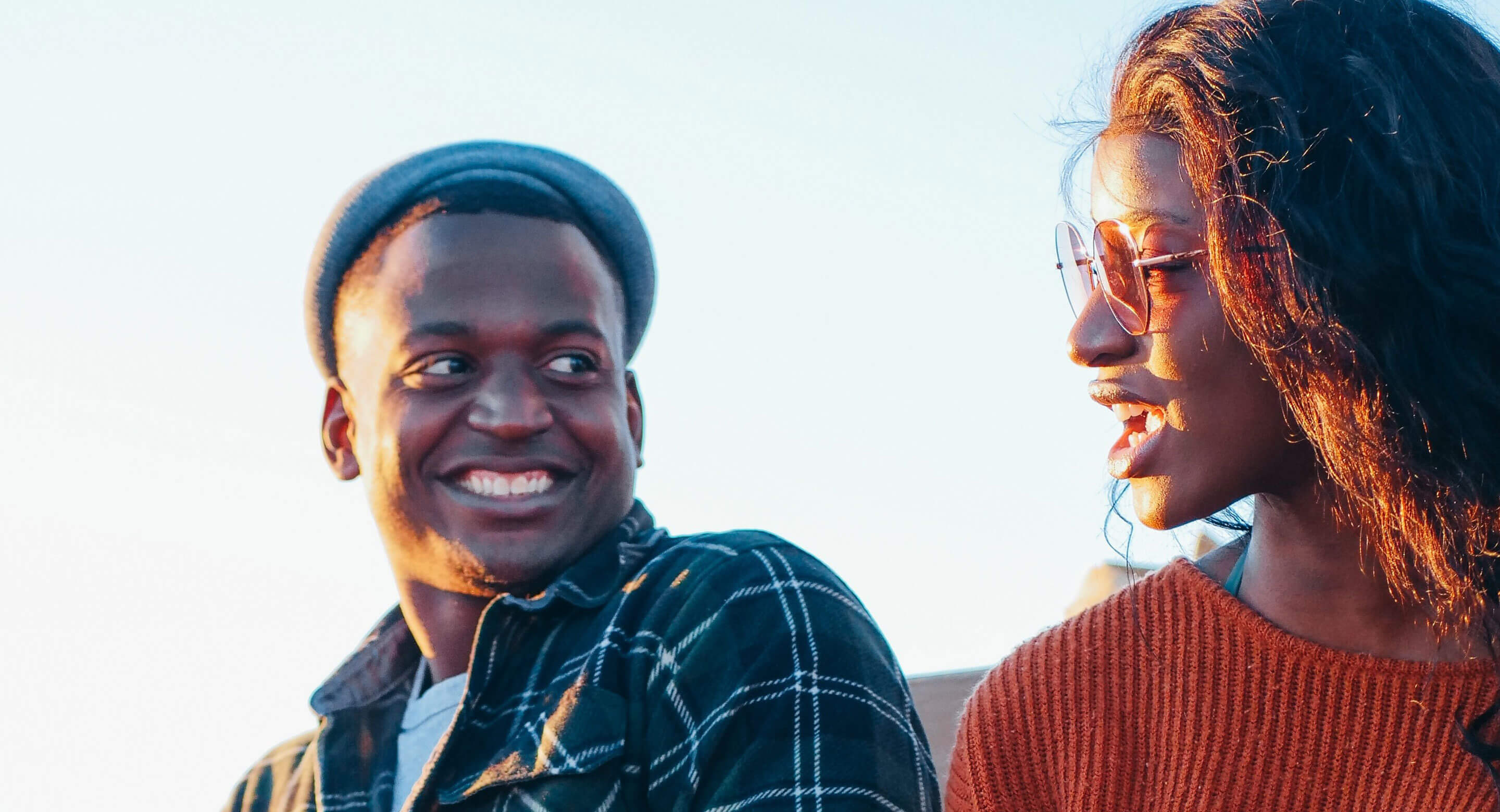 Two young people talking and smiling