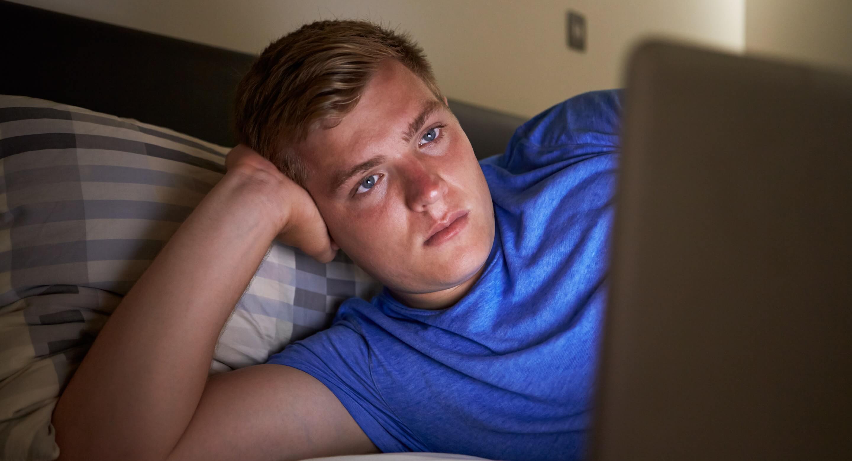 Young male looking at computer screen