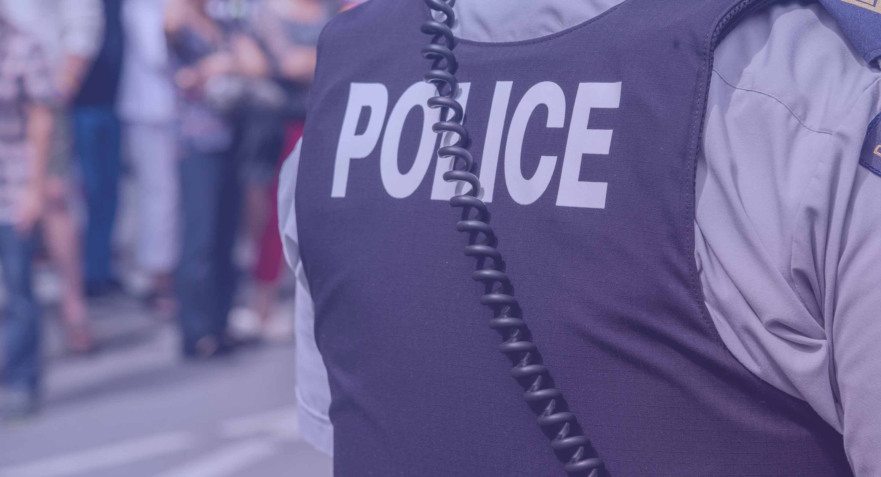 Photo of the back of a police officer