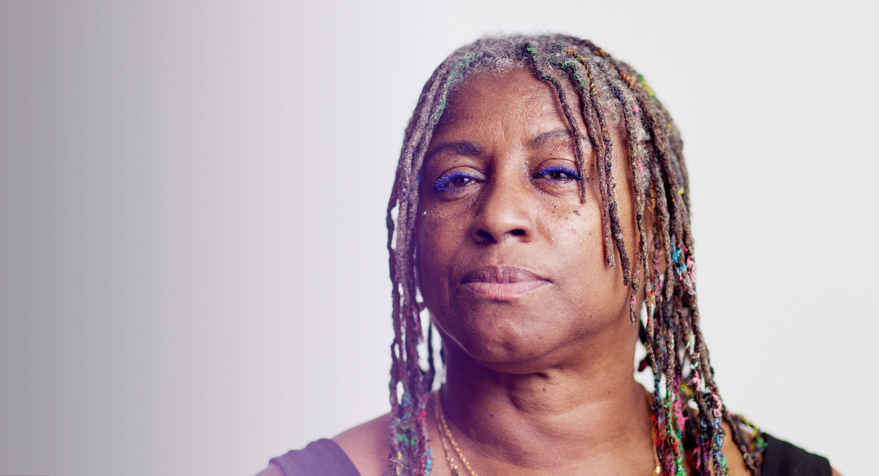 Resolute black woman with braids looking at camera 
