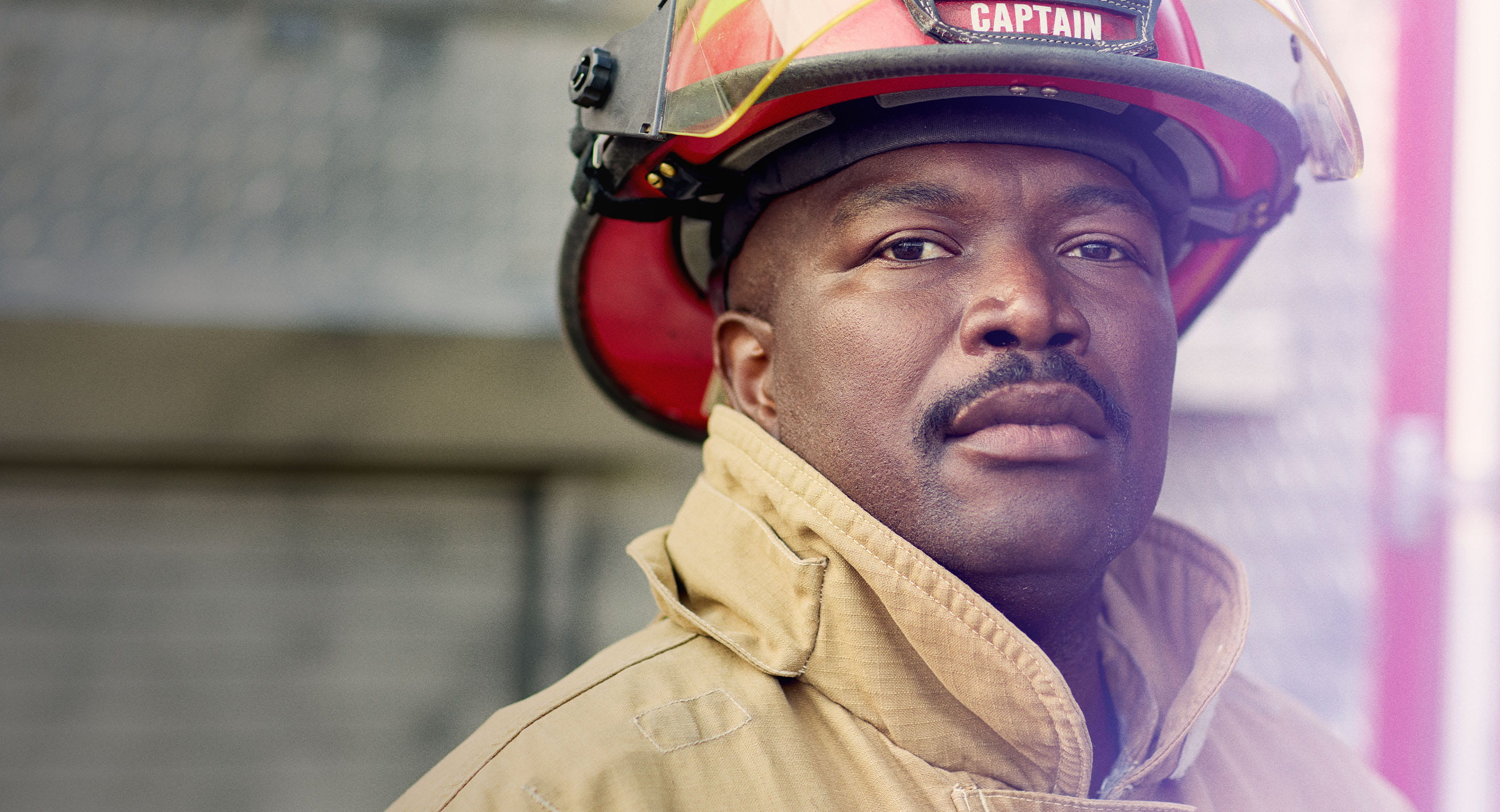 Middle-aged black fireman looking at camera