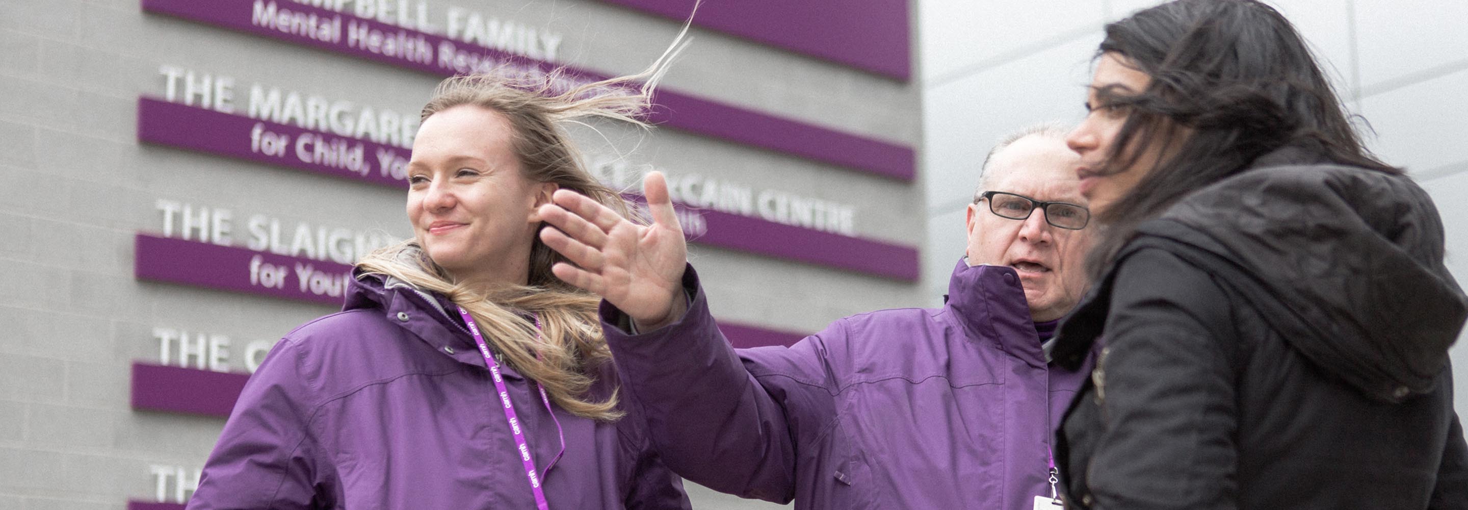 CAMH Community Ambassadors assist a visitor to CAMH.