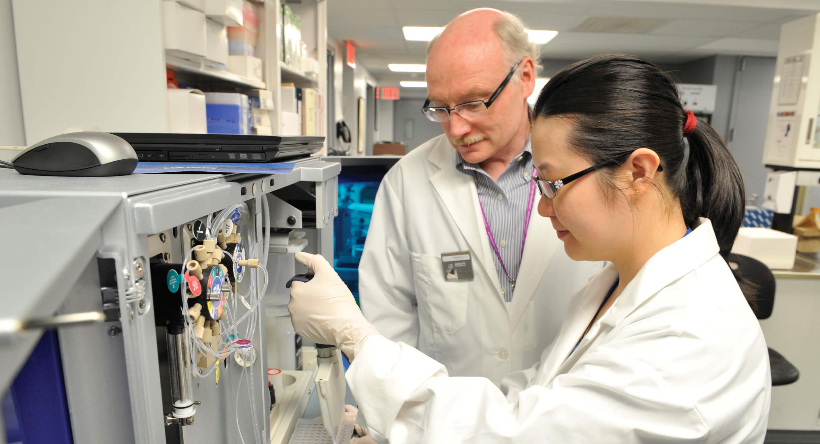 Dr. Jim Kennedy and Dr. Gwyneth Zai in laboratory