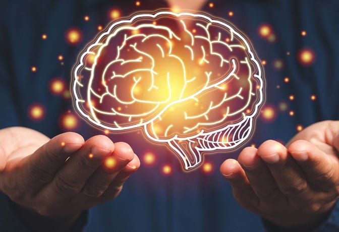 Image of a person holding up a virtual depiction of a brain