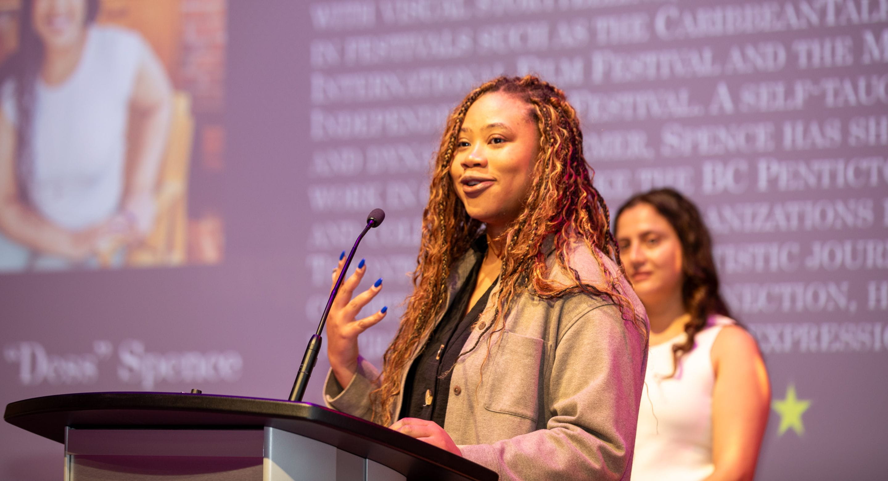 Affrica Spence performs spoken word poetry to audience