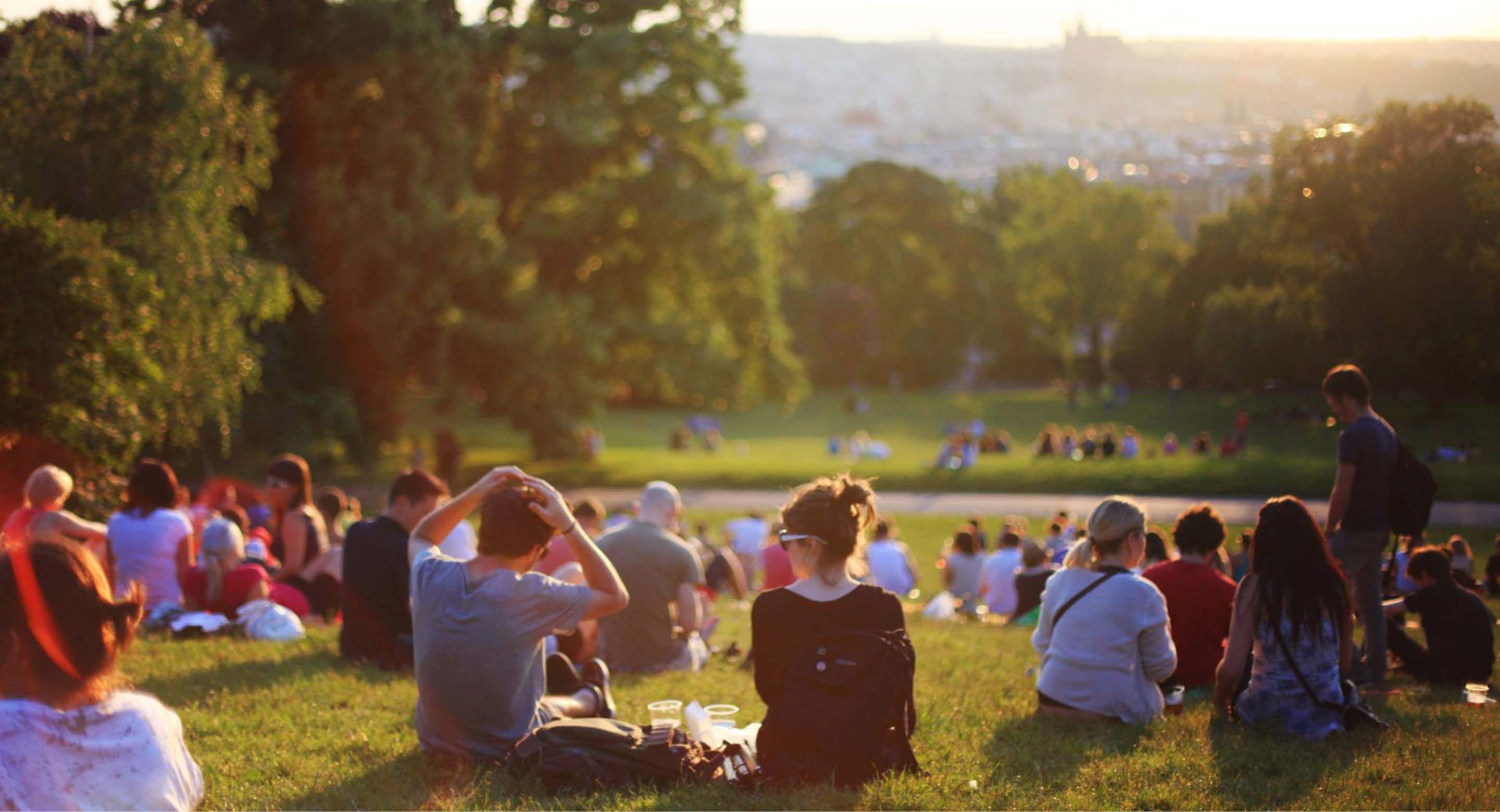 Group of people sitting in a park