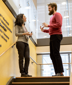 Azrieli Centre - Yona Lunsky talking to a colleague on BGB stairs