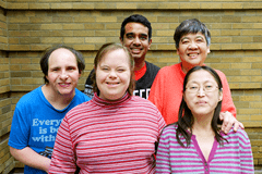 HCARDD group shot in front of a yellow brick wall